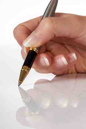 Hand and pen Well manicured hand and pen