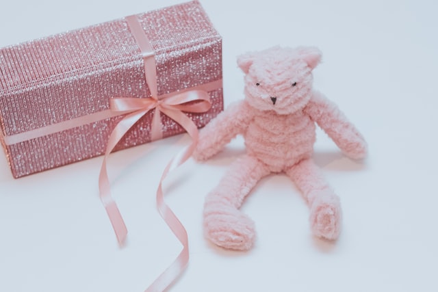 photo of pink crocheted bear and gift box